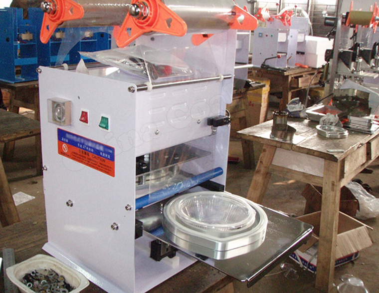 Malaysia buyer Visit China Coal for Purchase Cup Sealing Machine